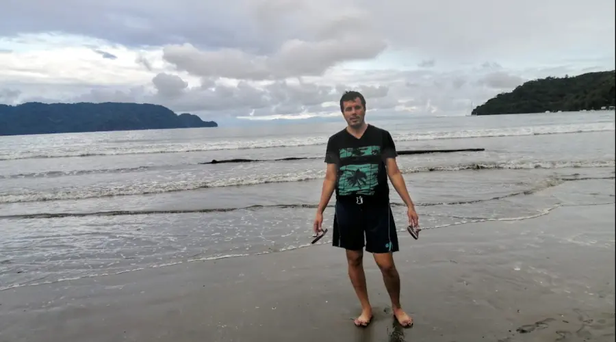 man in a beach at cloudy afternoon