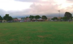 A view of a soccer field in a cloudy day